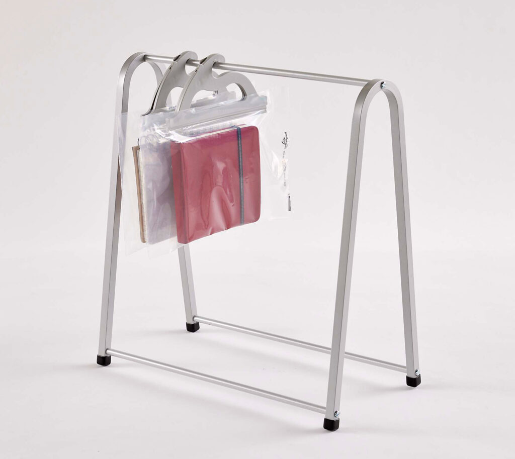 Anodized aluminum tabletop rack for hanging multi-use see-through poly storage bags – example bags hold books