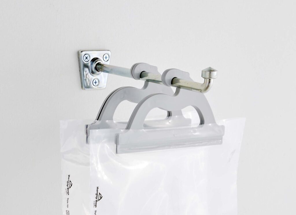 Metal bracket for walls or doors to hang multi-use poly storage bags